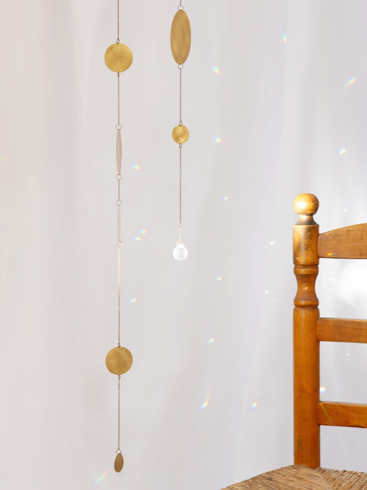 Atrapasol de cristal y latón